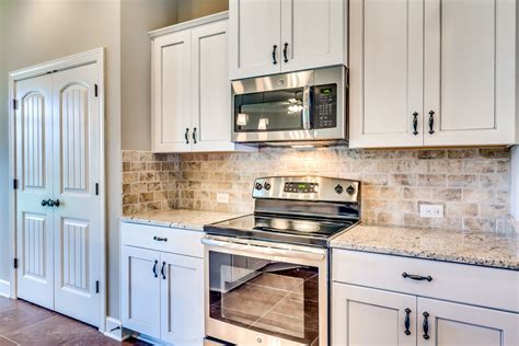 off white cabinets with stainless steel appliances|replace white with stainless appliances.